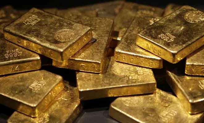 A pile of stamped fine gold bars